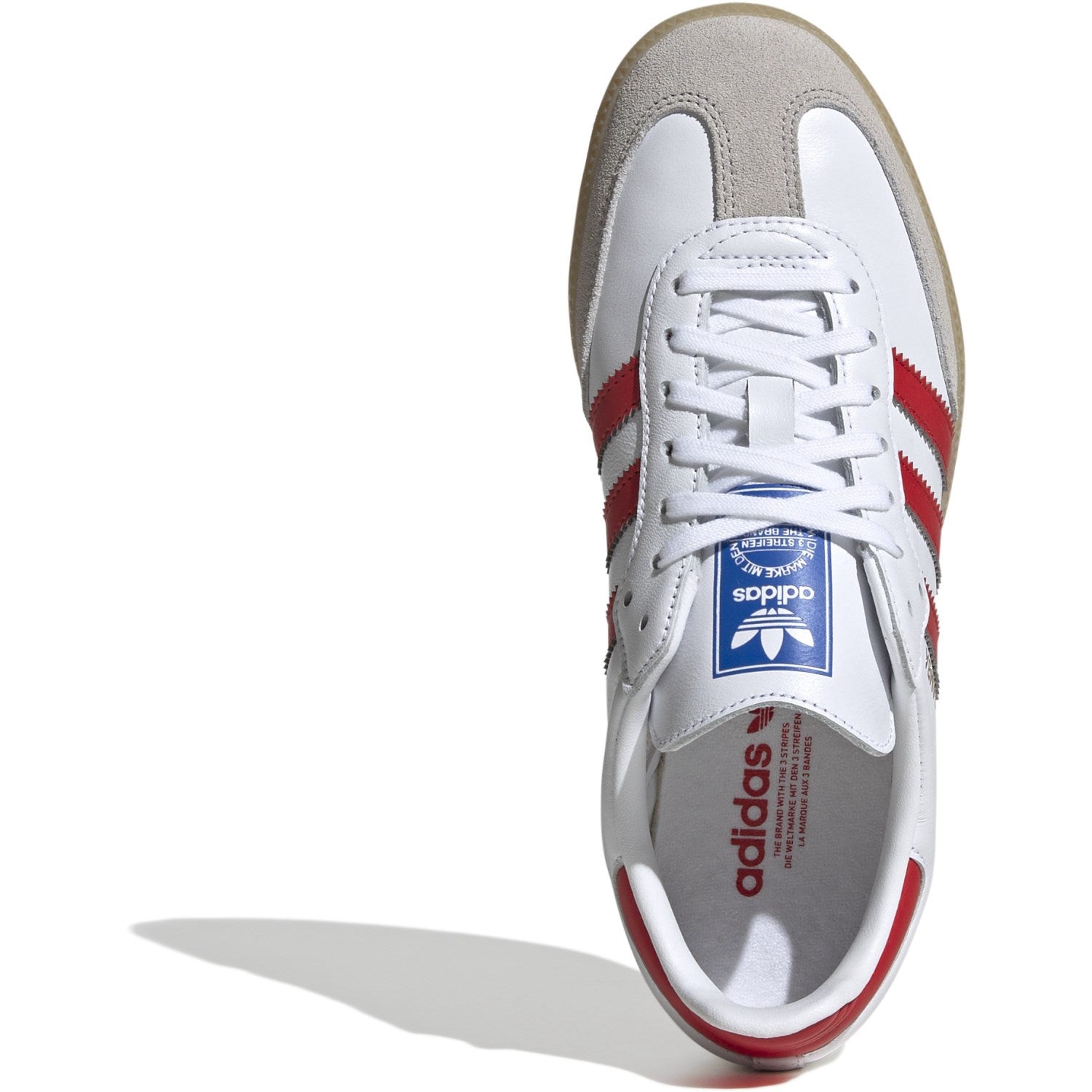 white adidas with maroon stripes