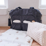 That's Mine Black Benne Nursing Bag